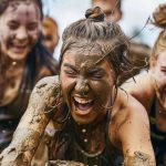 Athletes competing together in a mud run obstacle course race event