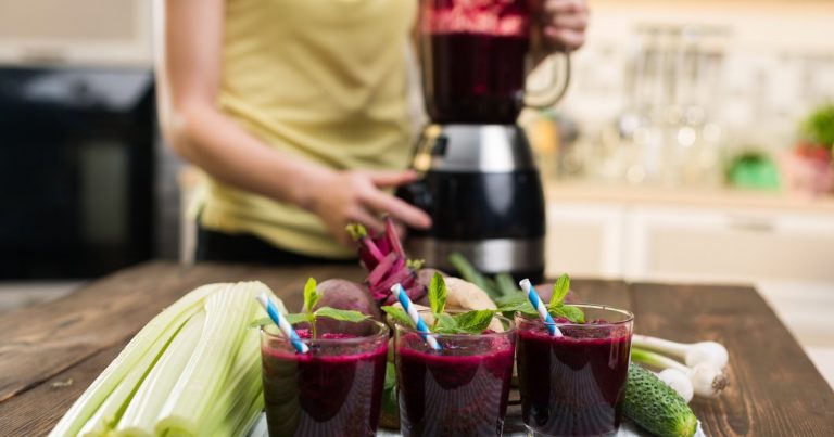 Beetroot smoothie and fresh vegetables for athletic nutrition