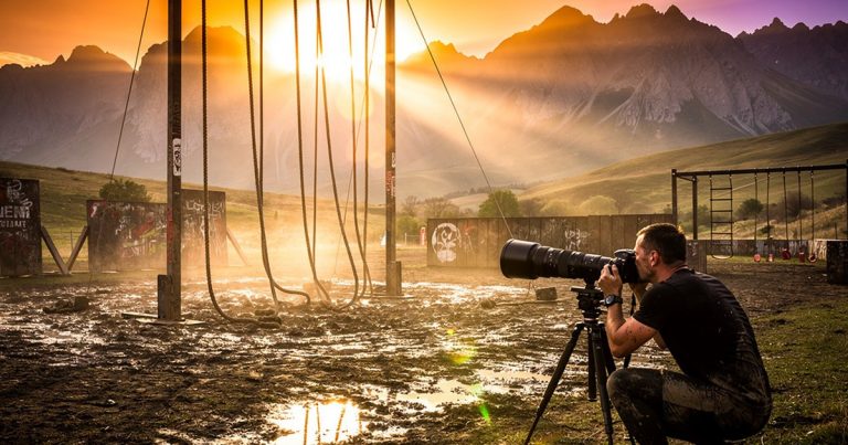 OCR race course photographer capturing athletes on the obstacles at golden hour