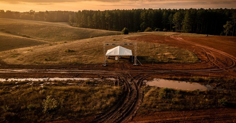 An empty OCR event site at golden hour, symbolizing a race series consolidating its schedule