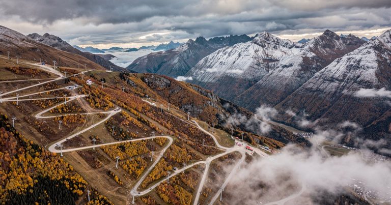 Fall OCR destination race venue — mountain resort landscape with autumn foliage