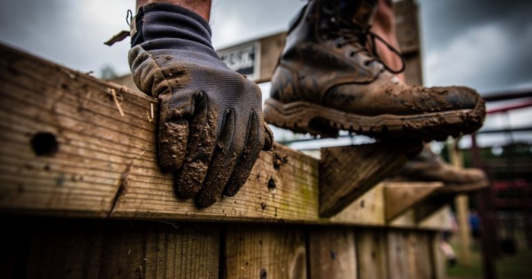 OCR athlete traverse wall technique hands on wooden holds