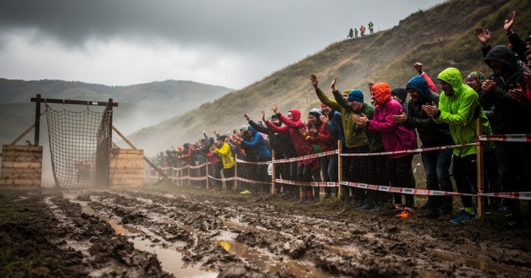 OCR race spectators cheering from the sidelines at an obstacle course event
